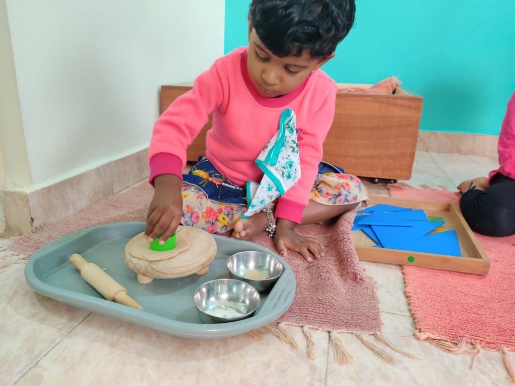 child playing with rolling board